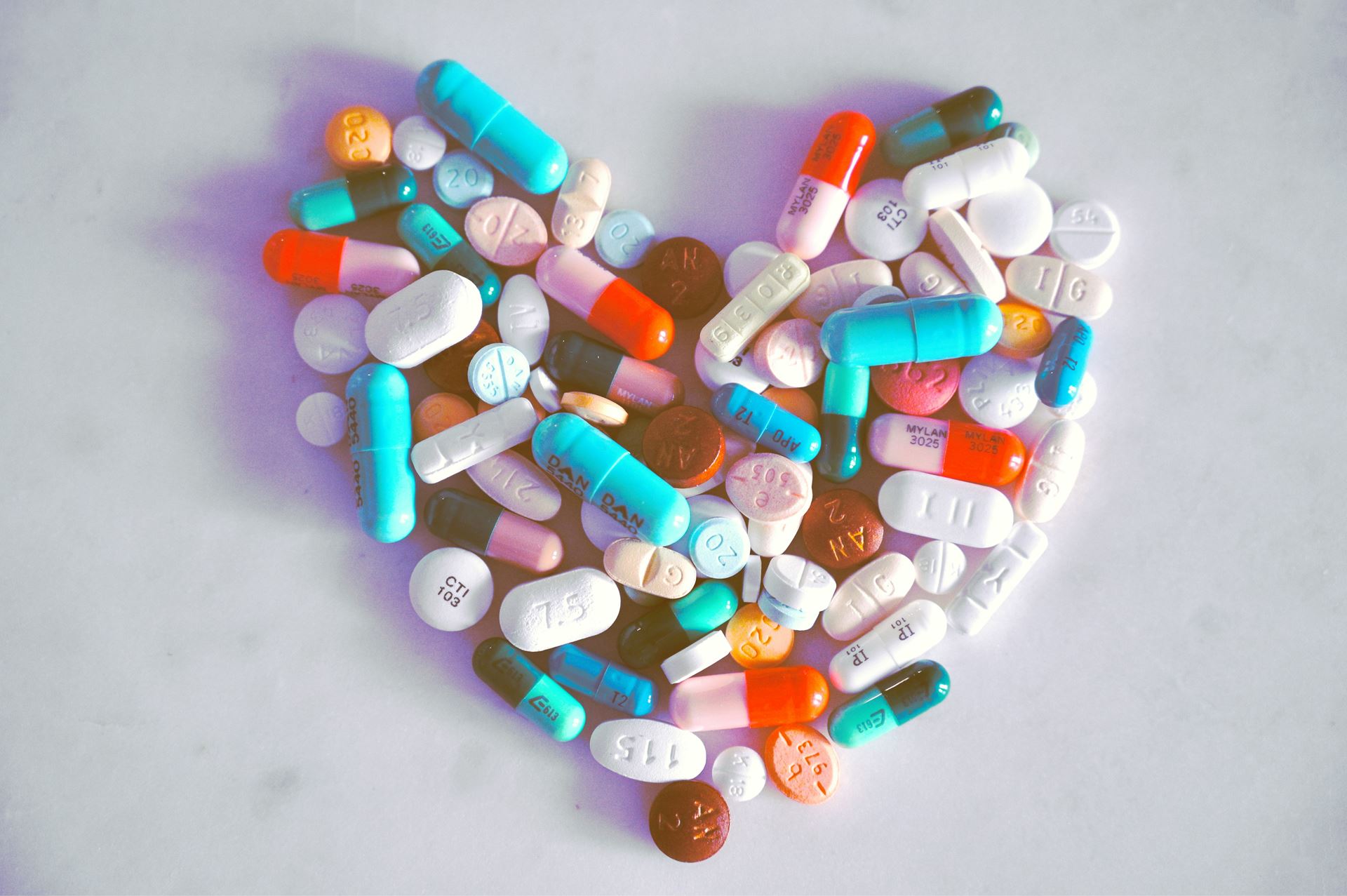 Medication tablets in the shape of a heart